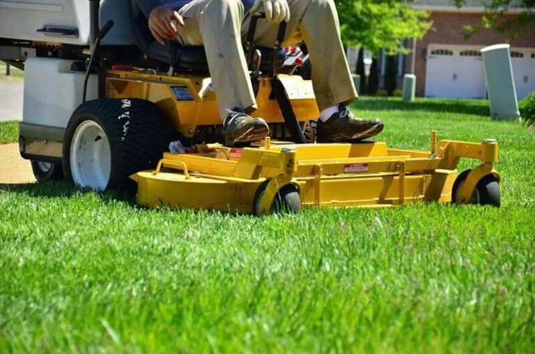 Man on lawn mower for Boise Lawn Service.