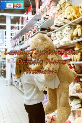 Woman holding stuffed bare in London Toy Store.