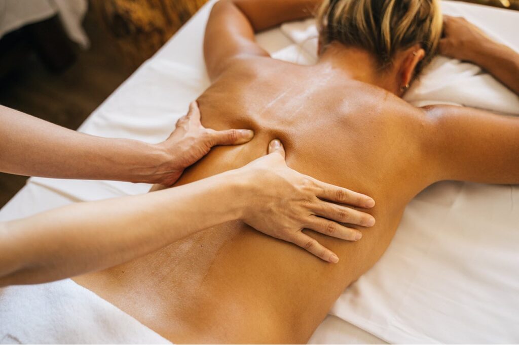 Woman receiving a back massage.