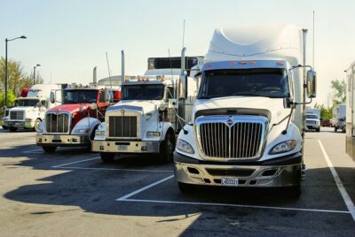 Trucks lined up in a row for professional truck driving training.